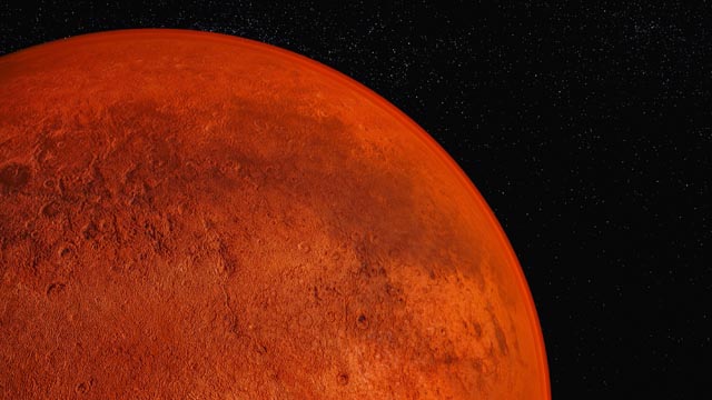 Heute wirkt der rote Planet trocken und staubig. Doch ein Blick in ein Stück Marsmeteorit zeigt: Wasser prägte die Kruste des Planeten schon sehr früh. © Adobe Stock